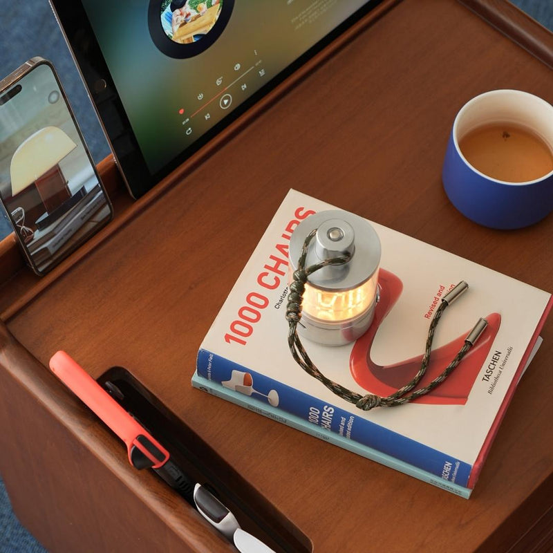 Desk setup with tablet, smartphone, book titled &