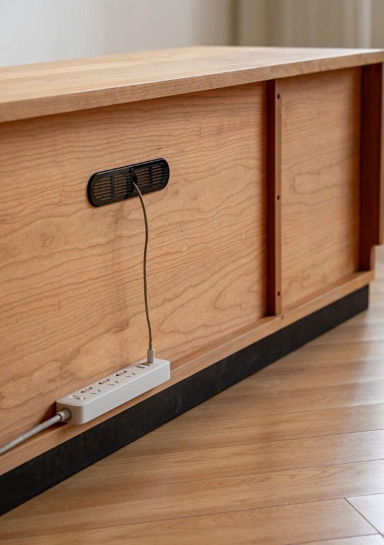 Wooden desk with power strip and cable management