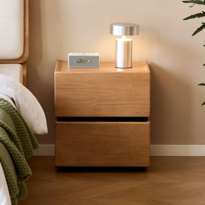 Wooden nightstand with lamp and speaker in a bedroom setting
